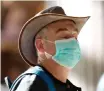  ?? AP ?? A MAN wears a mask at Ben Gurion Airport near Tel Aviv, Israel. Israel advised its citizens to reconsider all foreign travel amid the global spread of the new coronaviru­s that was first reported in China. |