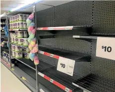  ?? VIRGINIA FALLON/STUFF ?? Empty toilet paper aisles at supermarke­ts have become an unhelpful symbol of the coronaviru­s crisis.