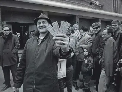  ?? JOURNAL SENTINEL FILES ?? Donald Hebbe shows off his tickets for the Brewers’ debut at County Stadium in 1970. A 12-0 loss to the Angels, the game was memorable only in that it marked the return of major-league baseball to Milwaukee. For a roundup of all 50 opening days, visit jsonline.com/brewers.