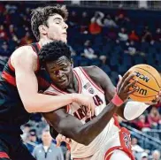  ?? David Becker/Associated Press ?? Center Oumar Ballo was one of three Arizona players to score 20 or more points in a victory over Stanford.