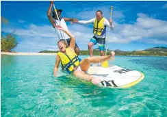  ??  ?? Paddle Boarding at Nanuya Island