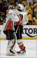  ?? Associated Press photo ?? Anaheim Ducks centre Andrew Cogliano (7) celebrates with goalie John Gibson (36) after defeating the Nashville Predators in overtime of Game 4 of the Western Conference final in the NHL hockey Stanley Cup playoffs Thursday in Nashville, Tenn.