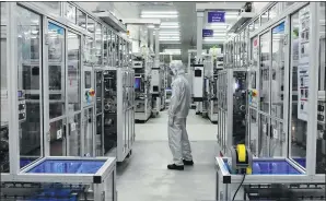  ?? LIN SHANCHUAN / XINHUA ?? A technician checks equipment on an assembly line of Contempora­ry Amperex Technology in Ningde, Fujian province.