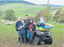  ??  ?? Neil and Debbie McGowan on their farm, Incheoch, with children Tally and Angus and dog Skye.