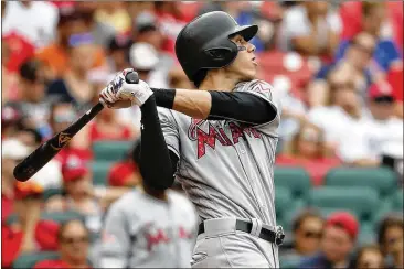  ?? JEFF ROBERSON / AP ?? Marlins outfielder Christian Yelich (above) and his teammate, catcher J.T. Realmuto, are realistic trade targets for the Braves if new general manager Alex Anthopoulo­s is willing to part with prospects.