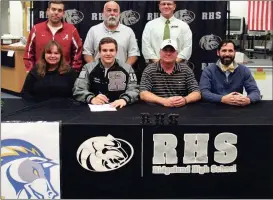  ??  ?? Carol and Thomas Coppinger were on hand at Ridgeland on Tuesday as their son, Austin, signed to continue his wrestling career at Briar Cliff University in Iowa. Also attending the signing ceremony were Ridgeland Athletic Director Robert Stinson,...