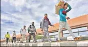  ?? SANCHIT KHANNA/HT ARCHIVE ?? Migrant workers walk down to their villages after announceme­nt of nationwide lockdown, on March 27.