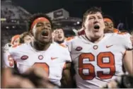  ?? SEAN RAYFORD — THE ASSOCIATED PRESS ?? Clemson quarterbac­k Kelly Bryant (2) and teammate Maverick Morris (69) celebrate after an NCAA college football game against South Carolina on Saturday in Columbia, S.C. Clemson defeated South Carolina 34-10.