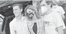  ?? MICHAEL LAUGHLIN/SOUTH FLORIDA SUN SENTINEL ?? Palm Beach County Supervisor of Elections Wendy Sartory Link celebrates her victory on Tuesday with her sons Christophe­r Link, left, and Michael Link.