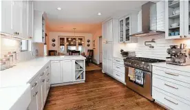  ?? Courtesy of Remodelers of Houston ?? This kitchen was part of a whole house remodel with an addition.