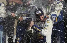  ?? JOHN MUNSON - THE ASSOCIATED PRESS ?? Chase Elliott celebrates his victory with his pit crew after winning a NASCAR Cup Series auto race at Watkins Glen Internatio­nal, Sunday, Aug. 4, 2019, in Watkins Glen, N.Y.