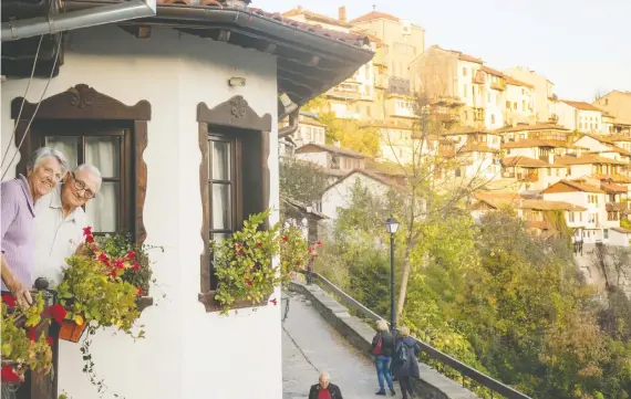  ?? PHOTOS: DINA MISHEV/THE WASHINGTON POST ?? The author’s parents take in the views at Hotel Gurko in Veliko Tarnovo, which is built on a steep hillside above the Yantra River.