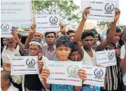  ?? /Reuters ?? Demanding recognitio­n: Rohingya refugees hold placards prior to the arrival of UN Secretary-General Antonio Guterres and World Bank president Jim Yong-kim at the Kutupalong refugee camp in Cox’s Bazar, Bangladesh, on Monday.