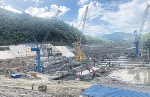  ??  ?? MOVING FORWARD: Constructi­on is under way in the second phase of the Nam Ou cascade hydropower project in Luang Prabang, part of Laos’ so-called Battery of Southeast Asia.