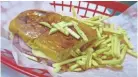  ??  ?? The medianoche is twist on a traditiona­l Cuban sandwich using a yellow sweet bread.