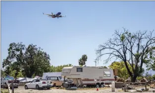  ?? KARL MONDON — STAFF PHOTOGRAPH­ER ?? A homeless encampment near San Jose Internatio­nal Airport remains occupied on May 4, one day after the City Council voted to extend a deadline for its removal until September.