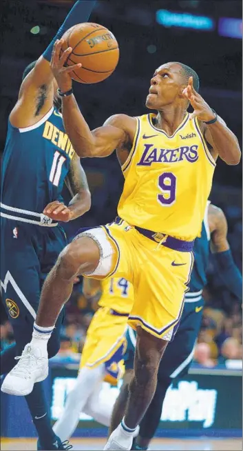  ?? Gary Coronado Los Angeles Times ?? RAJON RONDO, who has played with Dallas, Sacramento, Chicago and New Orleans since winning a championsh­ip in Boston, goes to the basket during a preseason game against Denver.