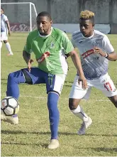  ?? IAN ALLEN ?? Jermaine Woozencrof­t (left) of Montego Bay United is being pressured for the ball by Courtney Allen (right) of Portmore United during their Red Stripe Premier League match at the Spanish Town Prison Oval on Sunday, November 11, 2018.