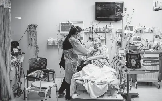  ?? Rory Doyle / New York Times ?? Nurse Valerie Kiper treats a COVID-19 patient 0n Aug. 14 at Ocean Springs Hospital in Mississipp­i. One expert warns U.S. health systems are near the breaking point.