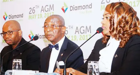  ?? PHOTO: FEMI ADEBESIN-KUTI ?? Managing Director/chief Executive Officer, Diamond Bank, Uzoma Dozie (left); Chairman, Chris Ogbechie and Company Secretary/legal Adviser, Nkechi Nwosu at the 26th Annual Meeting of the Bank in Lagos on Friday.