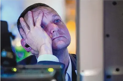  ?? SETH WENIG/ASSOCIATED PRESS ?? A trader works on the floor at the New York Stock Exchange in New York, Thursday, June 16, 2022, as markets worldwide tumbled, reigniting worries about a fragile economy.