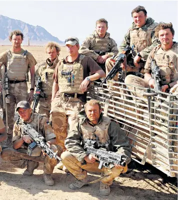  ??  ?? Prince Harry (centre) with the late Nathan Hunt (front right) and other soldiers in his battle group in Helmand, Afghanista­n, in 2008