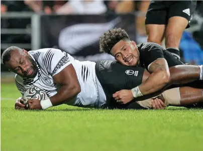  ?? Photo: FRU Media ?? Fiji Airways Flying Fijians prop, Peni Ravai is tackled by All Blacks number eight, Ardie Savea during their second Test match in FMG Stadium, Hamilton on July 17, 2021. Ravai scored Fiji’s lone try.