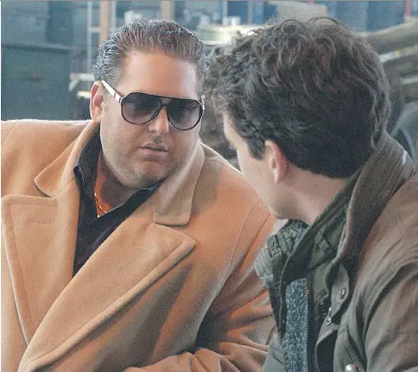  ??  ?? Jonah Hill and Miles Teller play a pair of boorish entreprene­urial milquetoas­ts in War Dogs, a poor attempt at satire by Hangover director Todd Phillips.