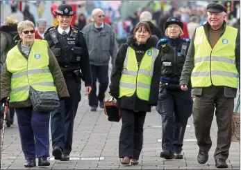  ??  ?? Mobilised:Janet Johnson, Pc Gemma Huckle, Sally Miller, PCSO Sue Sullivan and Terence Mustoo on patrol near Romford Market