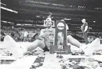  ?? JAMIE SQUIRE/ GETTY IMAGES ?? Jared Butler, the Final Four’s Most Outstandin­g Player, enjoys the spoils of Baylor’s first men’s basketball national championsh­ip.