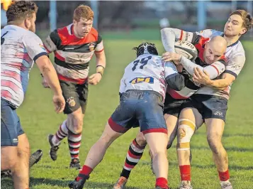  ?? ?? Determined Stirling’s Jonny Hope soldiers on despite being tackled on all fronts