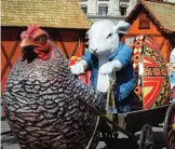  ??  ?? In this picture a child enjoys a ride in an Easter inspired installati­on at a fair in Bucharest, Romania.