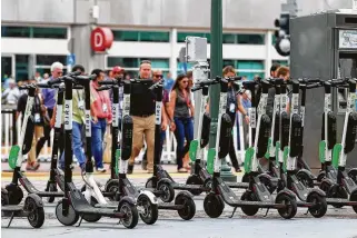  ?? Eduardo Contreras / Tribune News Service ?? Electric scooters are parked in San Diego in July. In Austin, city leaders have asked the Centers for Disease Control and Prevention to investigat­e scooter-related crashes and injuries.