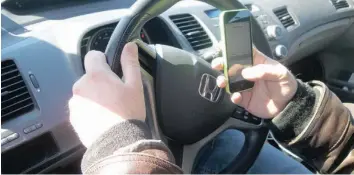  ?? —photo archives ?? The Province of Ontario recently unveiled new legislatio­n to deter against distracted driving. Fines for a first-time offender could be as high as $1000 and result in three demerit points and a three-day driving license suspension.