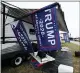  ?? JOHN RAOUX — THE ASSOCIATED PRESS ?? Flags supporting President Donald Trump fly in the infield on Friday.