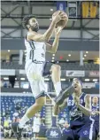  ?? BOB TYMCZYSZYN/POSTMEDIA NETWORK ?? The Niagara River Lions' Tyler Murray drives to the basket against Halifax Hurricanes' Billy White in National Basketball League of Canada action Wednesday at Meridian Centre in St. Catharines.