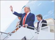  ?? Pablo Martinez Monsivais / Associated Press ?? President Donald Trump stops to wave as he steps off Air Force One with first lady Melania Trump and their son Barron Trump. Trump radio will soon be coming to Hartford.