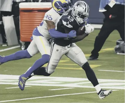  ?? PICTURE: JAE C. HONG/AP ?? 2 Dallas Cowboys wide receiver Michael Gallup (No 13) makes a catch but is called for offensive pass interferen­ce on Los Angeles Rams cornerback Jalen Ramsey. The incident in yesterday’s game sparked an intriguing discussion about the effectiven­ess of Ramsey.