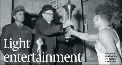  ??  ?? President Yitzhak BenZvi accepts torch, 1953