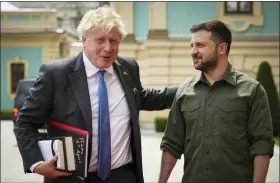  ?? UKRAINIAN PRESIDENTI­AL PRESS OFFICE VIA AP ?? In this image provided by the Ukrainian Presidenti­al Press Office, Ukrainian President Volodymyr Zelenskyy, right, and Britain’s Prime Minister Boris Johnson, ahead of their meeting in Kyiv, Ukraine, Friday.