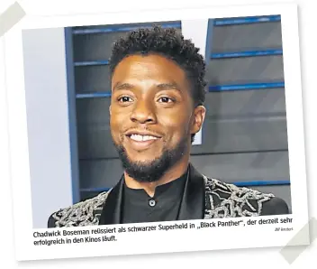  ?? Reuters ?? derzeit sehr in „Black Panther“, der als schwarzer Superheld Chadwick Boseman reüssiert läuft. erfolgreic­h in den Kinos