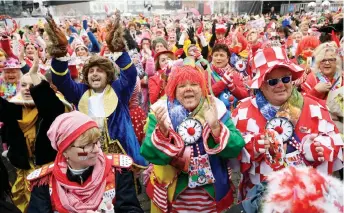  ?? — AFP photo ?? Revellers celebrate the start of the Carnival season in Cologne, western Germany.