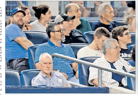  ?? Getty Images; AP ?? FOREWARNIN­G: After criticizin­g Yoenis Cespedes (right) for playing golf the same day he aggravated his right quad injury, Mets general manager Sandy Alderson watched Thursday’s Subway Series finale from the Yankee Stadium stands.