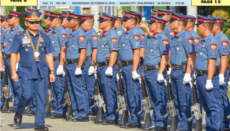  ??  ?? NEWLY installed acting police regional director Police Brig. Gen. Filmore Escobal walks past his troops during the arrival honor prior to the command turnover ceremony at Camp Quintin Merecido on Tuesday. BING GONZALES