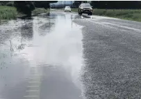  ?? PHOTO: DANIEL BIRCHFIELD ?? Water line . . . Surface flooding on State Highway 83 near Georgetown, inland from Oamaru, yesterday.