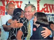  ??  ?? Ed Garvey hugs a campaign volunteer and his wife, Betty, during his 1998 campaign against Gov. Tommy Thompson. For more photos, go to jsonline.com/news.