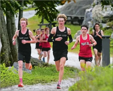  ?? DANA JENSEN/THE DAY ?? From left, East Lyme’s Sean McCauley, Brendan Fant, and NFA’s Ethan Manfredi lead the race during a boys’ cross country meet on Tuesday at Rocky Neck State Park in East Lyme. Fant won the race. McCauley was second and Manfredi was third as East Lyme swept the tri-meet, beating NFA 19-39 and Waterford 15-49.