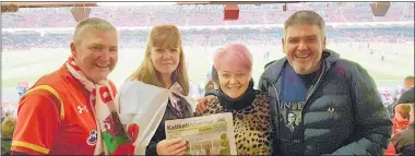  ??  ?? The Katikati Advertiser was spotted at an internatio­nal rugby match in Cardiff — Wales v Tonga — seen here with Katikati couple David and Suzanne Roberts (left) with David’s brother Robbie and wife Alwena, inside the Principali­ty Stadium. The Roberts went back to their homeland in North Wales recently to visit family and friends. While there they went to Cardiff to watch one of the autumn internatio­nal rugby matches.