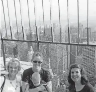  ?? [PHOTO PROVIDED BY BETH STEPHENSON] ?? Left to right, Beth, Kimberly, Nathan (in arms) and Tricia Stephenson enjoy the view from the 86th floor observatio­n deck of the Empire State Building.