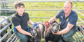  ??  ?? Tex mex Shaun Lammie with his uncle Iain from Cumnock and their Blue Texels